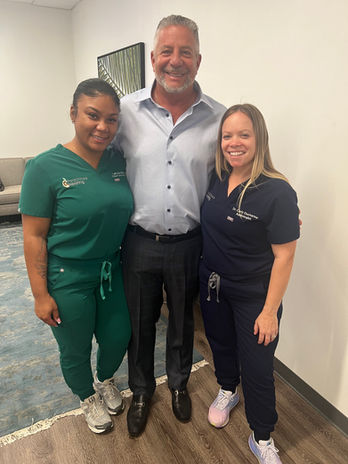 Coach Bruce Pearl with Dr. Carly Ducharme and LaKaya