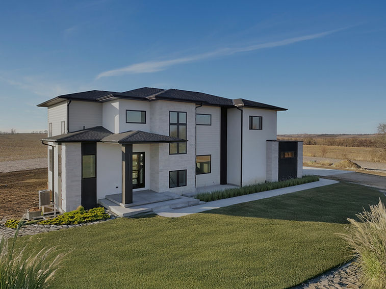 Luxury Modern white two-story house in an open field.