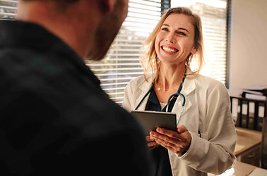 A female doctor smiling at her patient.