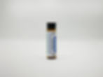 Single upright homeopathic vial standing on white background with readable product label in focus.