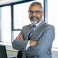 experienced-businessman-standing-office-room-indian-content-office-employee-eyeglasses-smi