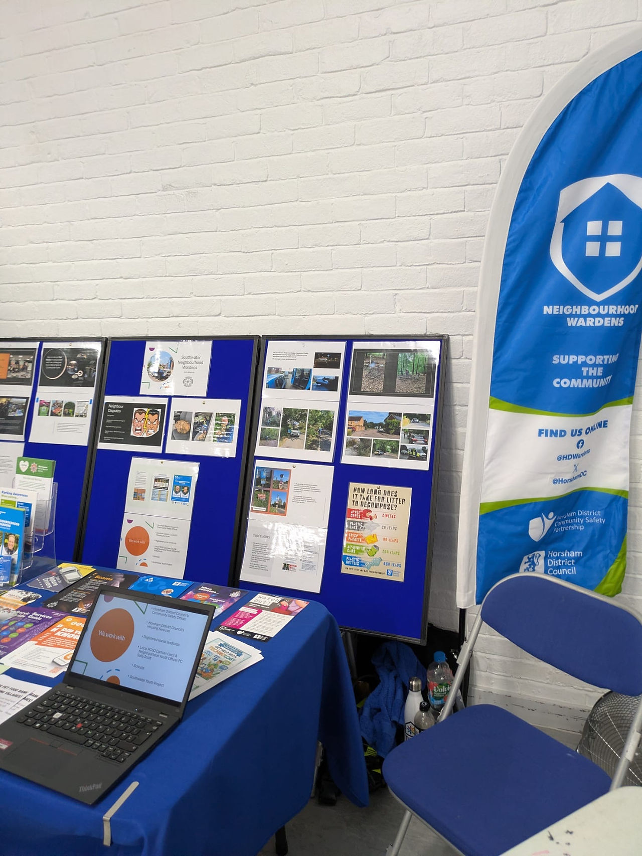 A laptop, leaflets and display boards to promote Neighbourhood wardens.
