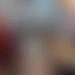 Indoor Play. Audition sitting on chairs on the left side of the photo. Foreground shows a player in action. Fairy lights, British flags and wooden beams for decoration.