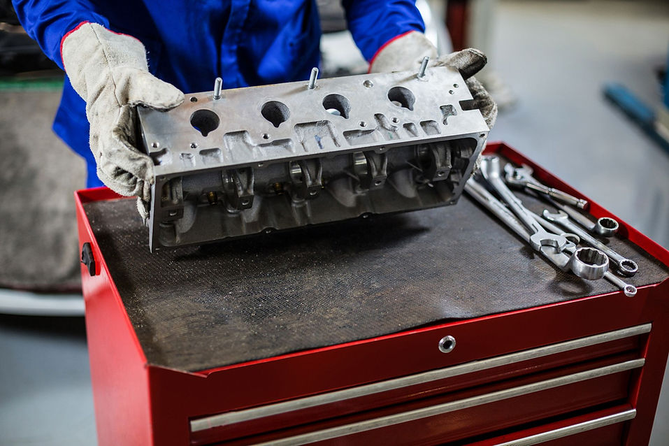 European or Japanese engine cylinder head on the bench during an engine replacement in Salt Lake City