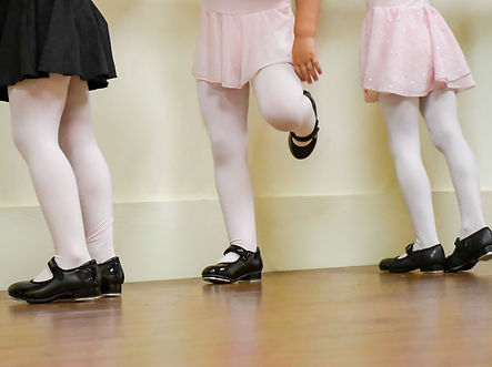little girls in tap shoes dance class.jpg