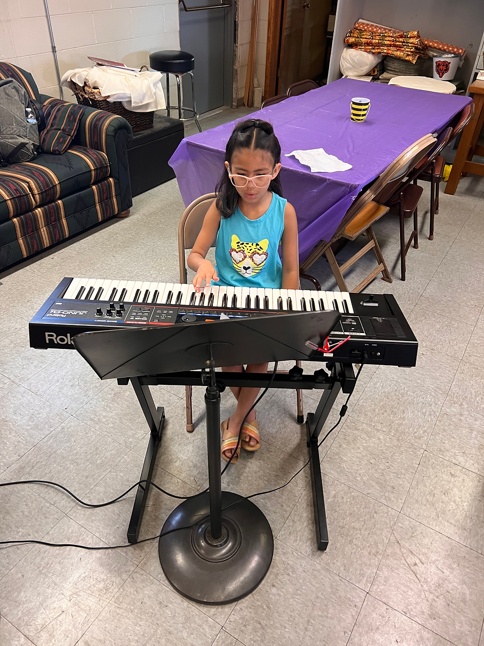 Girl playing Roland keyboard