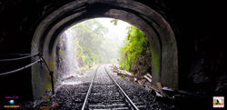 Passing through the railway tunnel which is surrounded by green moss