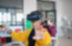 Teenage students wearing virtual reality goggles at school in computer science class.jpg