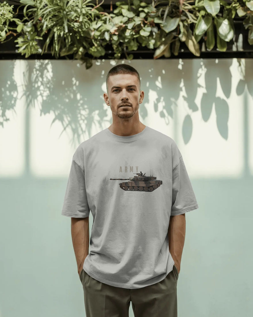 Man wearing grey t-shirt with "ARMY" and tank graphic, standing. LUXR