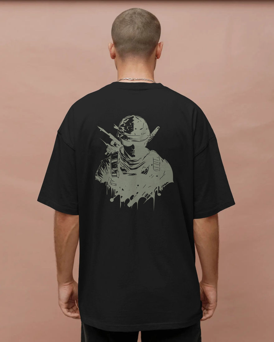 Man wearing black T-shirt with soldier graphic on the back.