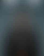 Woman wearing a black hoodie with a cartoon graphic, LUXR branding and text elements.