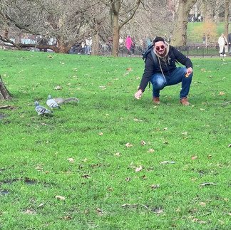 man giving food to squirrel
