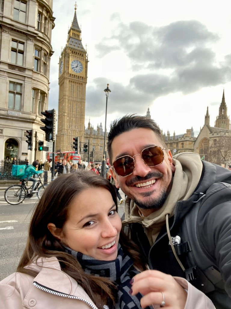 couple smiling standing in front of big ben london