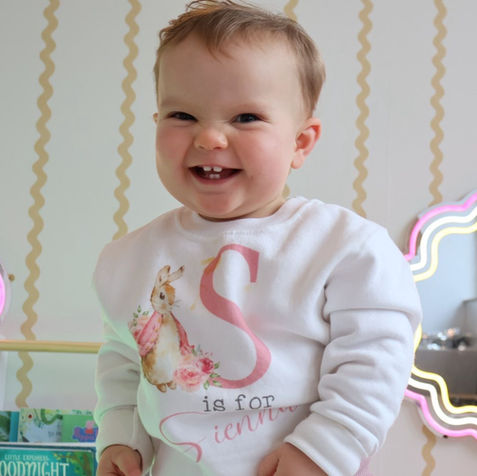 Baby smiling at camera