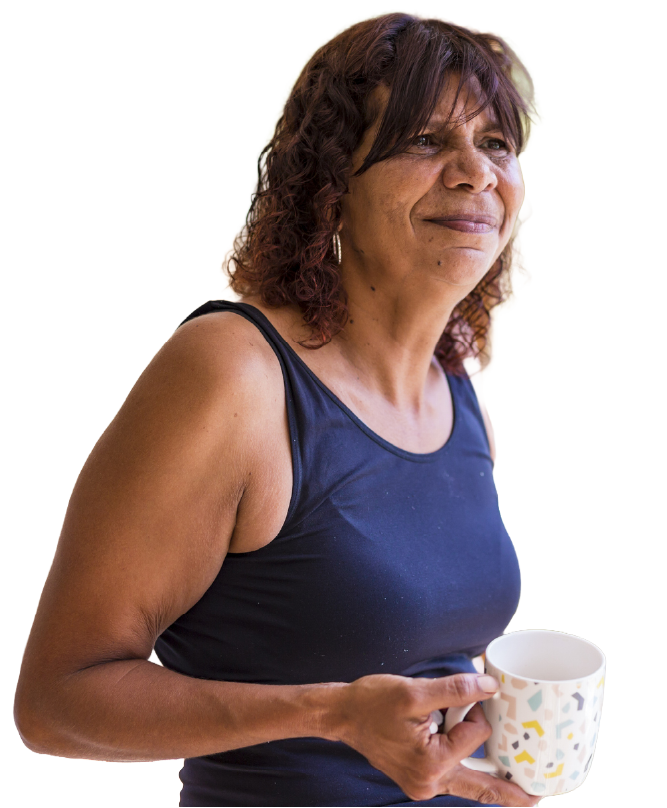 Smiling woman holding a mug, reflecting comfort and culturally inclusive women's health support.