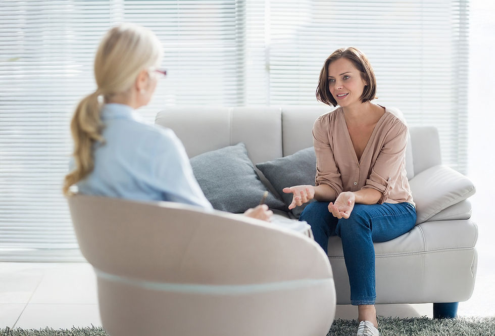 A woman talking to a therapist in a session
