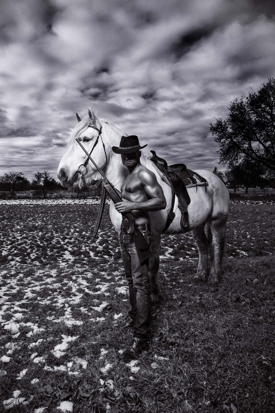 Rider on horse in black and white, dramatic fine art photography