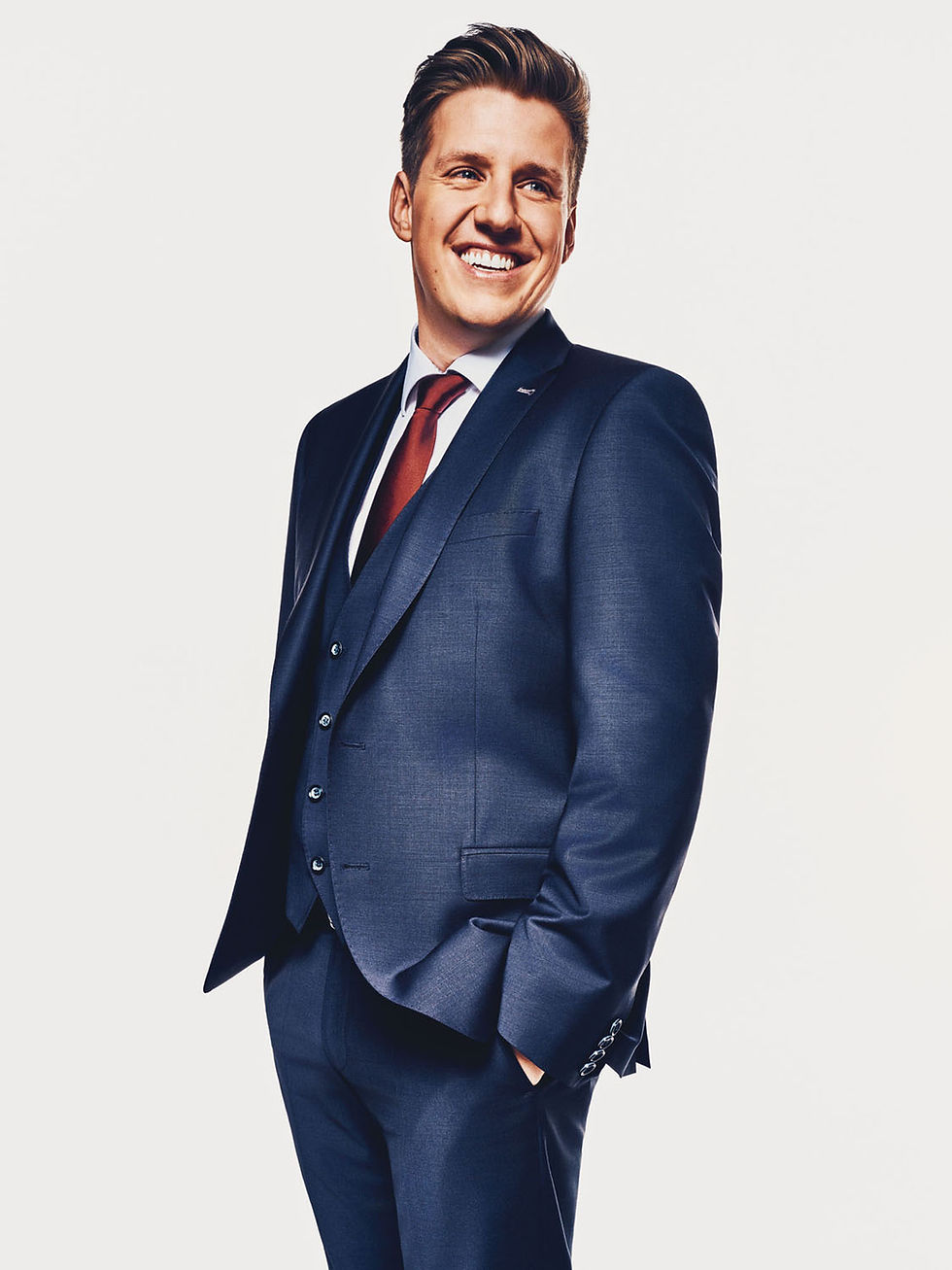 professional portrait of an executive in a navy blue suit, communicating confidence and corporate au