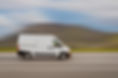 Cargo van is driving on the highway at speed with a blurred background. Freight transport,