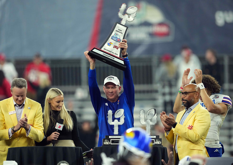 LANCE LEIPOLD HOLDING THE GUARANTEED RATE BOWL TROPHY