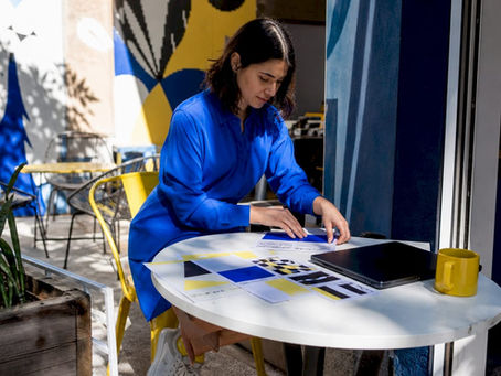 Marketing professional organizing visual branding materials