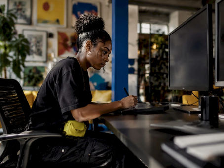 Designer working on t-shirt mockup on digital tablet