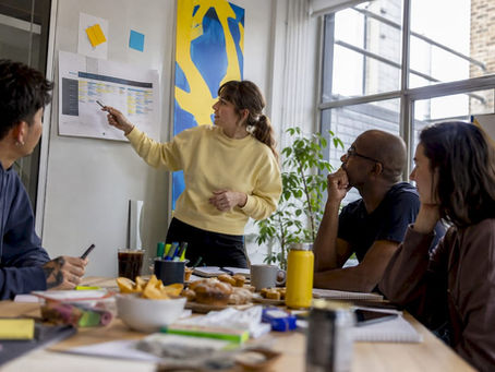 Production manager leading team meeting
