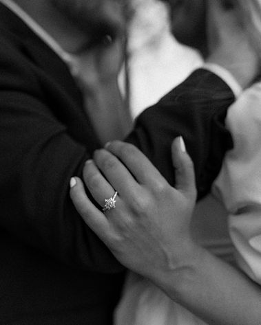 Romantic close-up of couple embracing during golden hour.