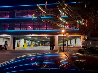 Parking garage at night, neon lights Inviting Light, Guilford Hall Brewery.