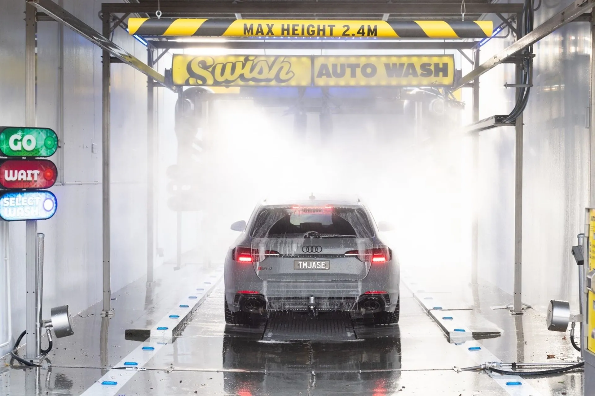 Car being washed at Petit Auto Wash Equipment