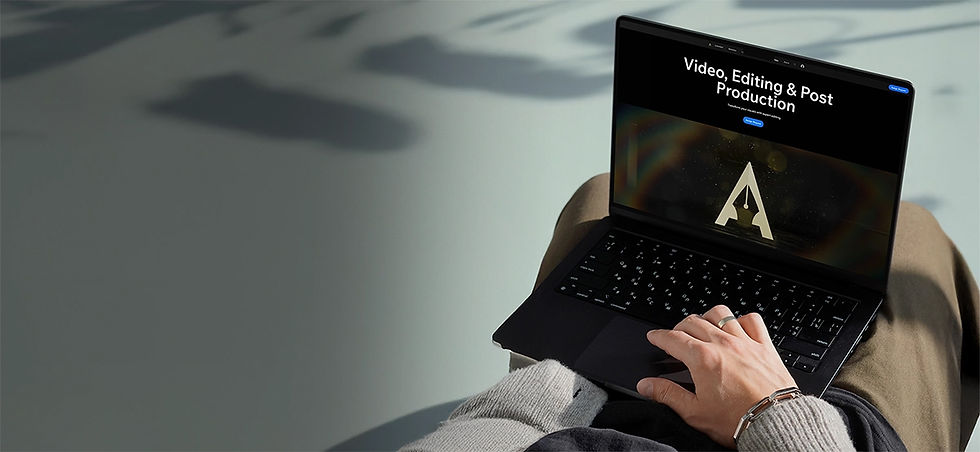 Laptop displaying Video, Editing & Post Production, person operating it on lap.