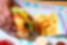 Mike's Hand With Burger & Fries On Tray.webp