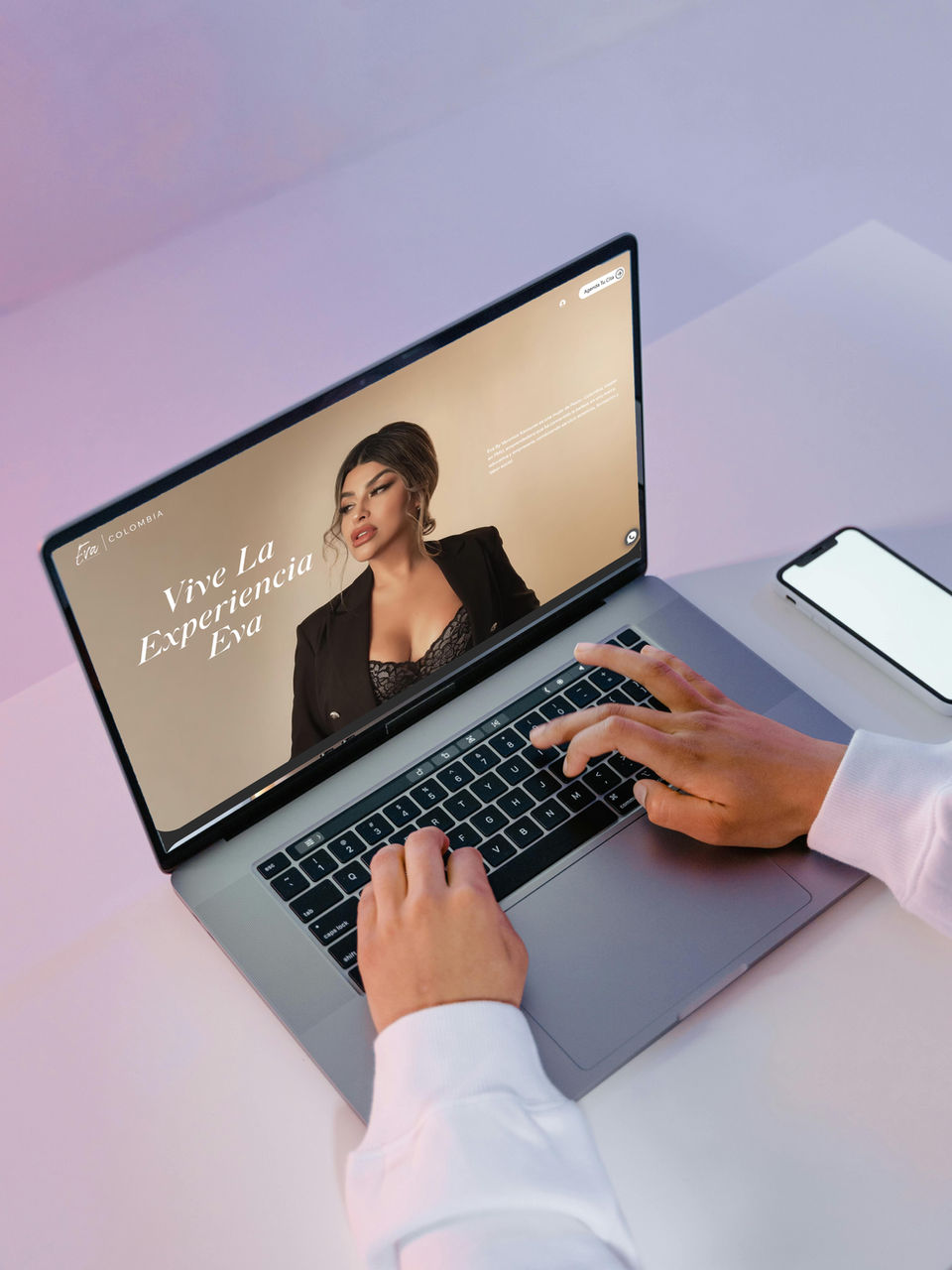 Hands typing on laptop, woman on screen for SEO optimized websites