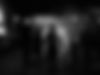 Silhouette of family holding hands, looking at a stage performance About True Talent