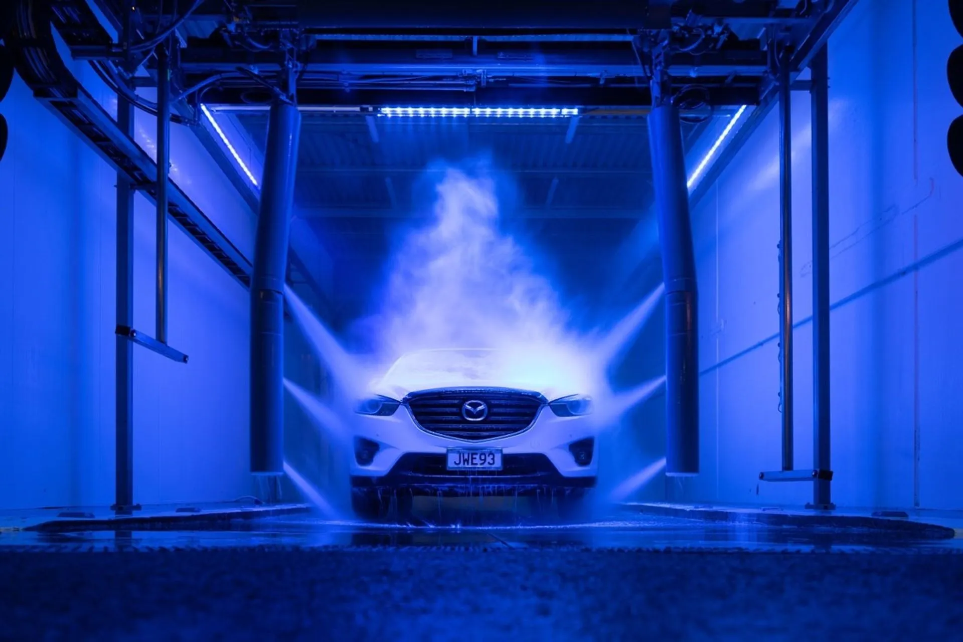 Car being washed at Petit Auto Wash Equipment