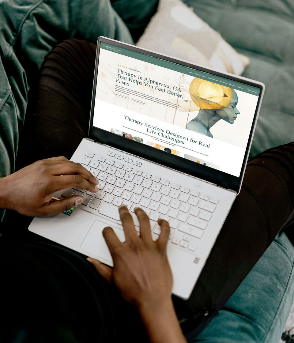 Person typing on laptop, viewing an SEO optimized website