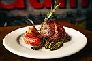 Grilled steak with roasted potatoes and asparagus on white plate