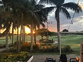 Palm trees and golf course at sunset with a beautiful sky. dev-edison