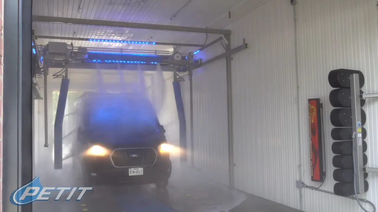 Car being washed at Petit Auto Wash Equipment