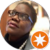 Woman with glasses looking up, Google Local Guide icon