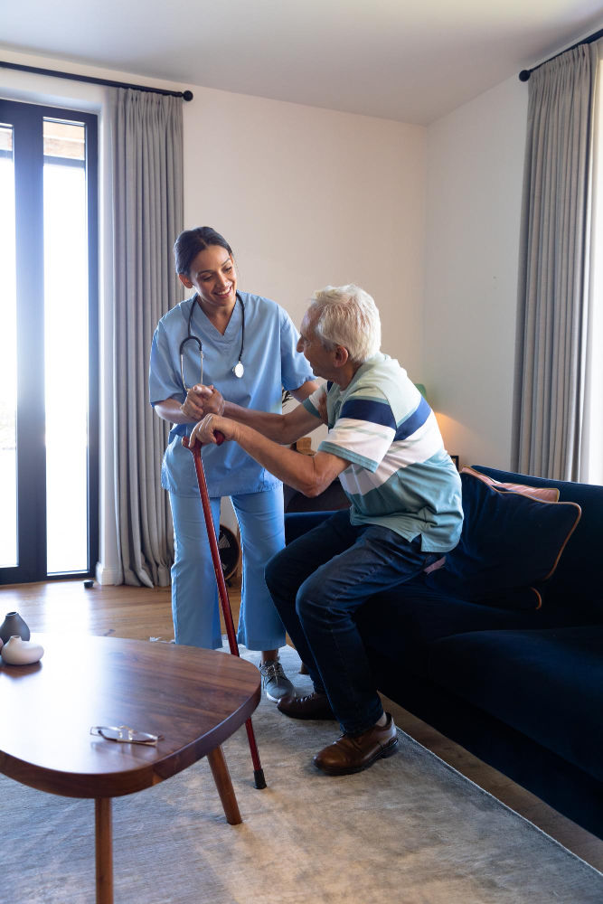 Nurse helping senior man at home