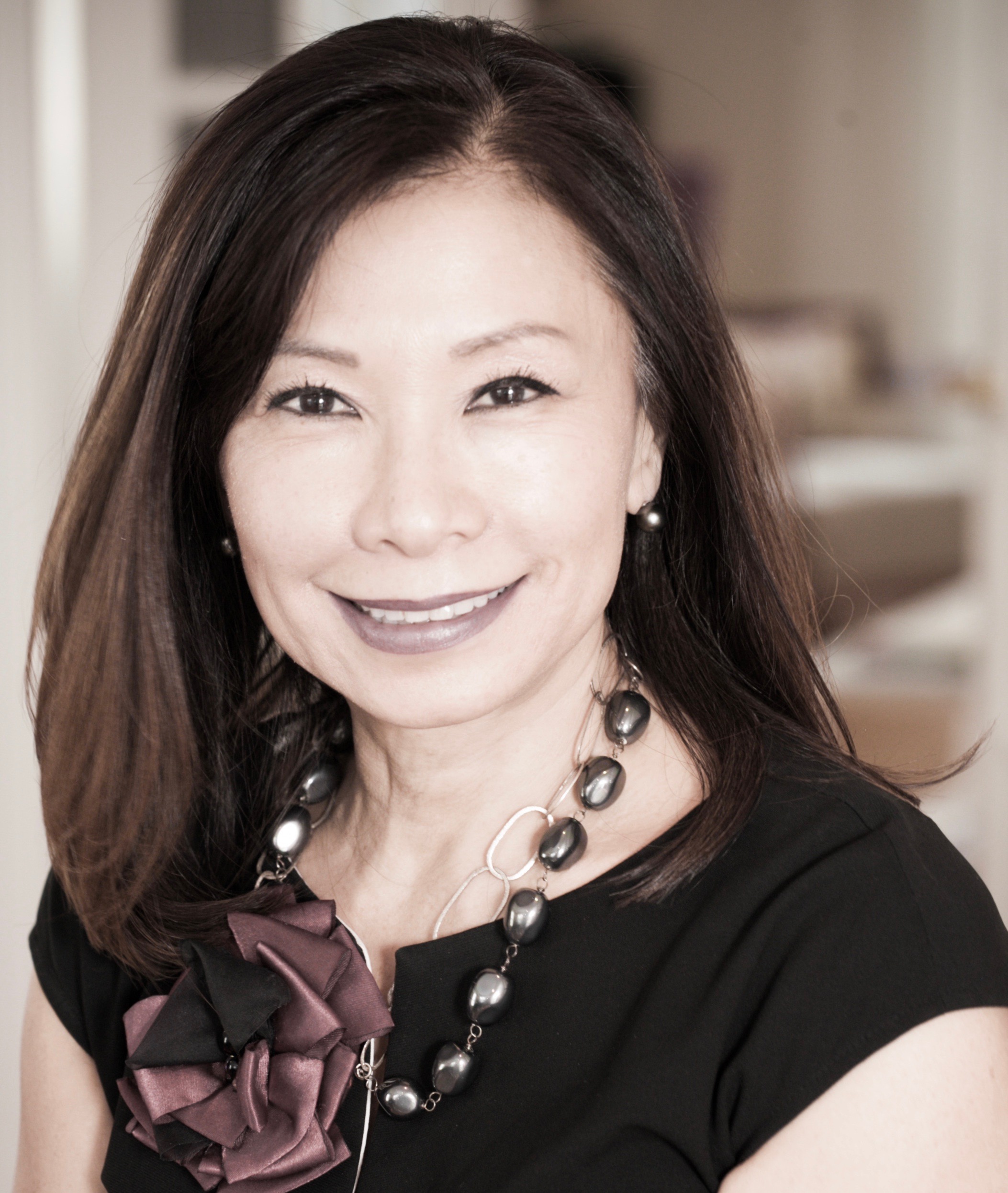 Professional headshot of a smiling female team member.