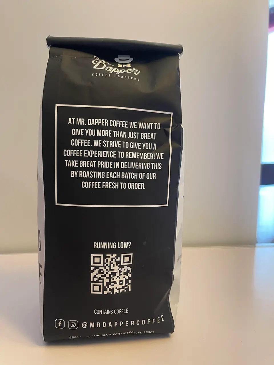 Black coffee bag with text