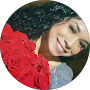 Smiling woman holding red roses