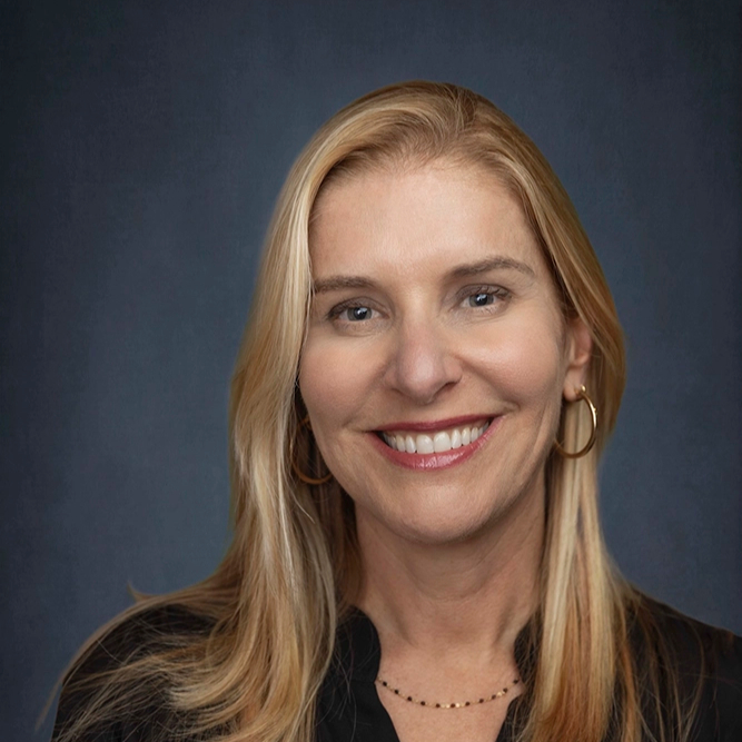 Smiling blonde woman in a professional team portrait