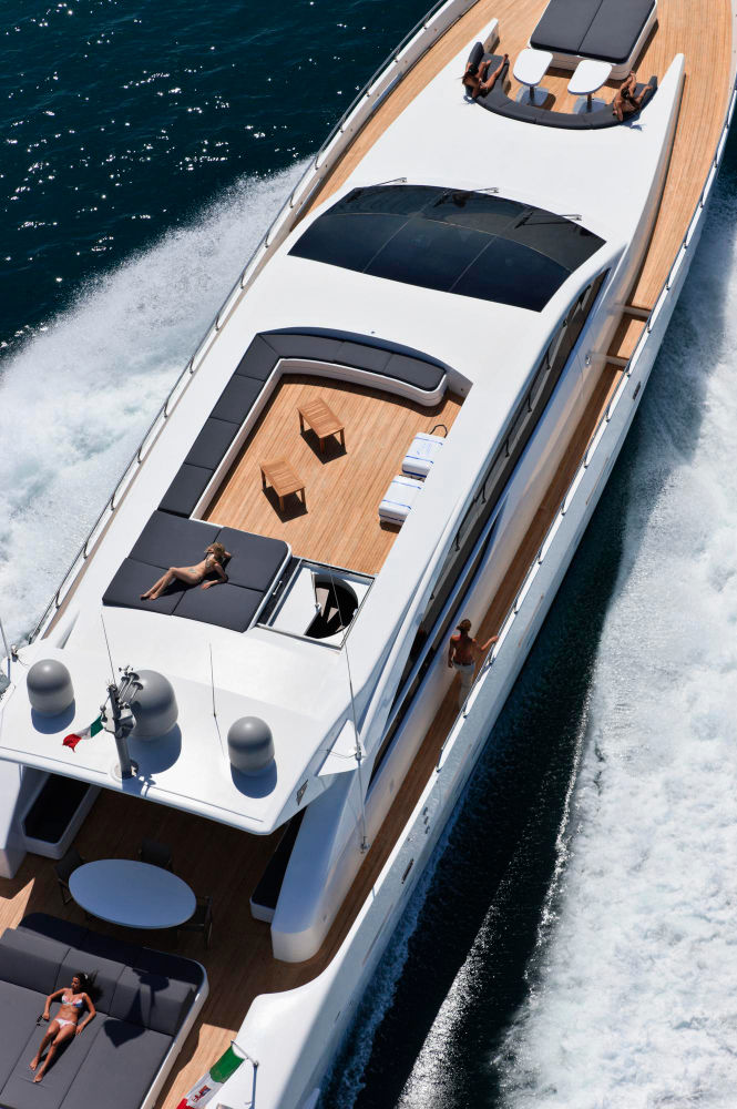Aerial view of a luxury yacht cruising on the ocean.
