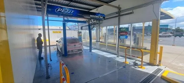 Car being washed at Petit Auto Wash Equipment