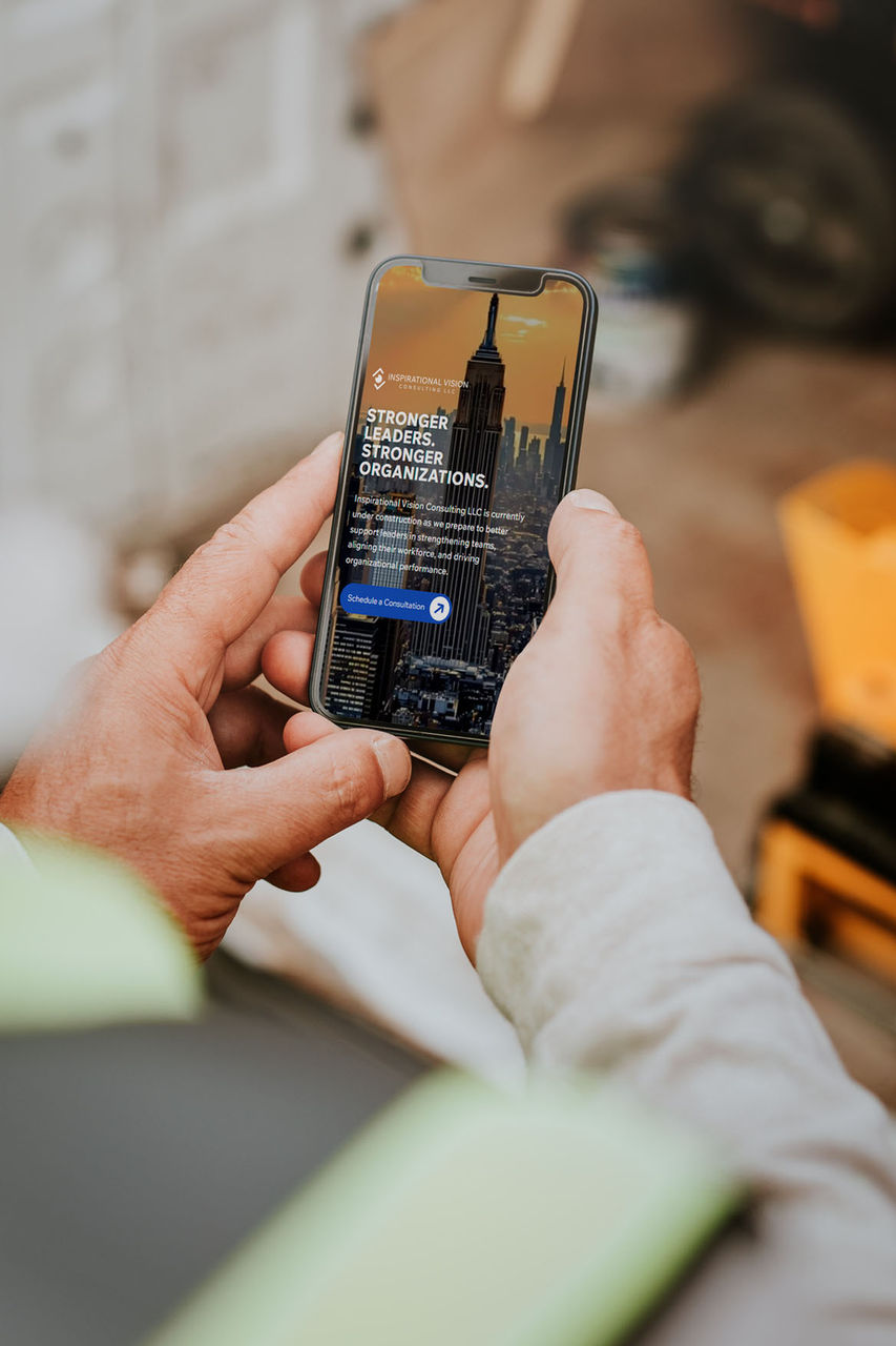 Hands holding a smartphone viewing a website