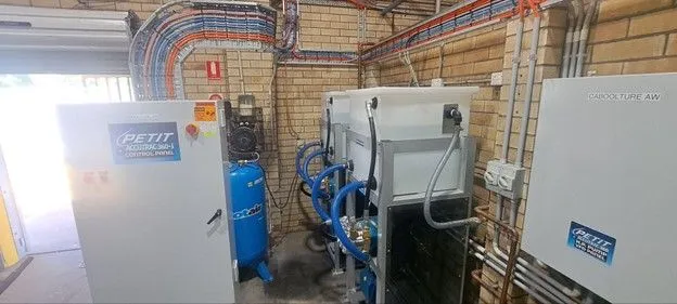 Petit Auto Wash Equipment machinery and equipment in a service bay