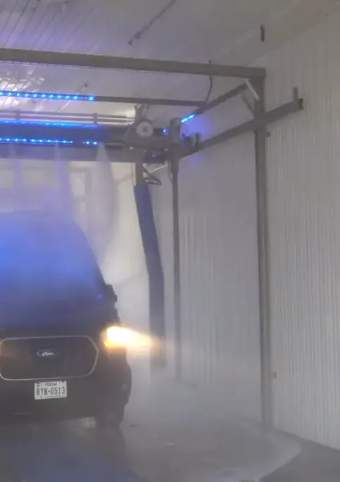 Car being washed at Petit Auto Wash Equipment